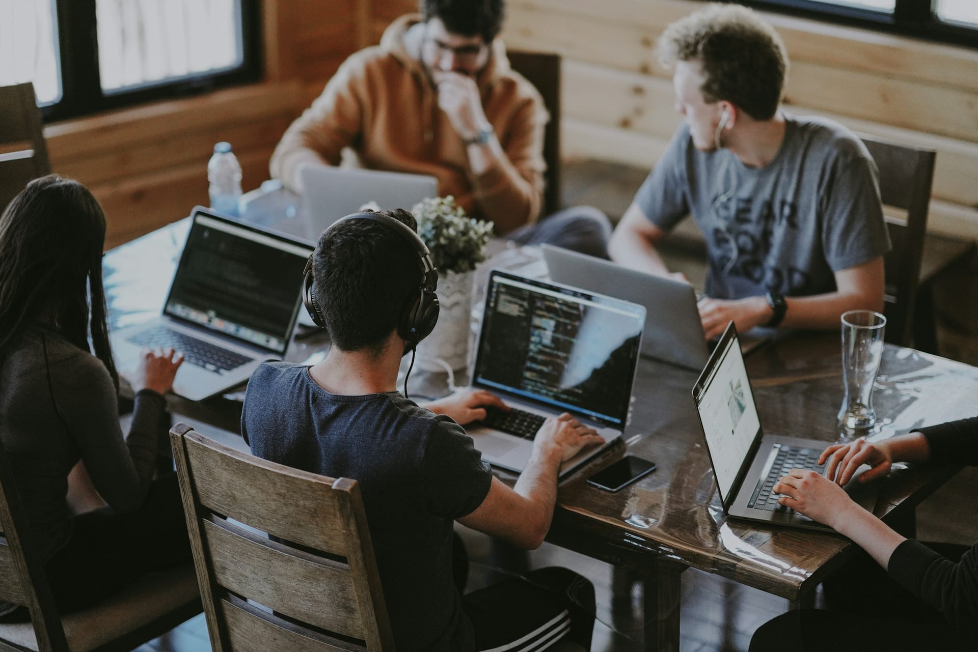 A recruitment team working together in a bright office environment